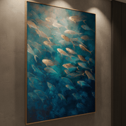 Framed artwork of fish swimming in water on a wall