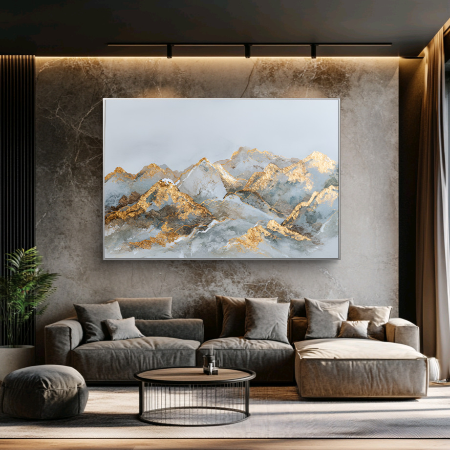 Modern living room with a gray sectional sofa, round coffee table, and abstract mountain painting on the wall.