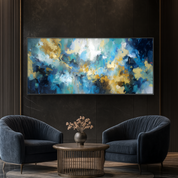 Modern living room with abstract painting on a dark wall, two blue armchairs, and a wooden coffee table.