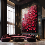Modern living room with a large floral painting on the wall, a purple sectional sofa, and decorative elements.