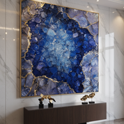 Decorative wall art with blue and gold mineral-like pattern in a modern interior setting.