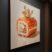 Framed artwork of a sushi roll with a gold topper on a dark wall.