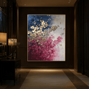 Abstract floral painting in a dimly lit room with a lamp and decorative items.