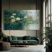Living room with a green sofa, coffee table, and large painting of water lilies on the wall.